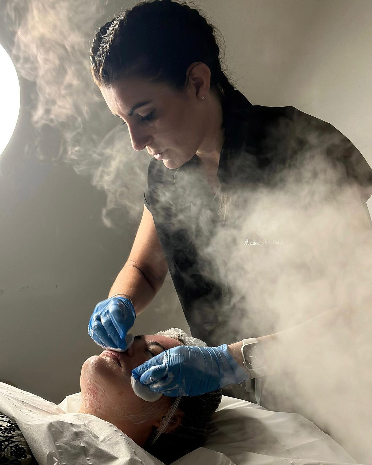 Elle treating a client at Medics Aesthetics Clinic